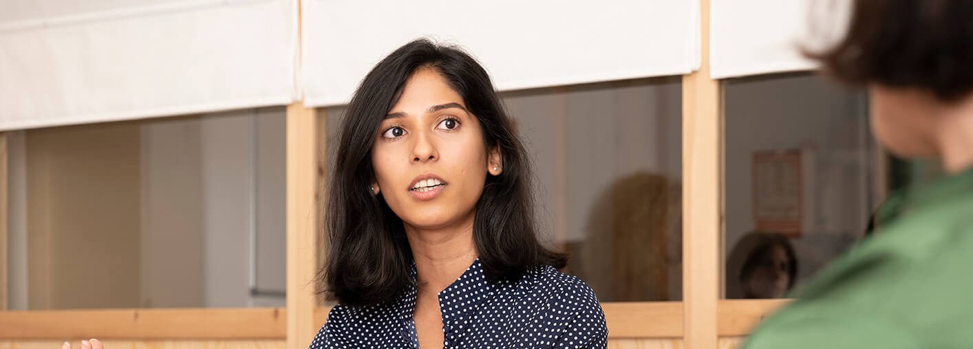 A young female English student speaking